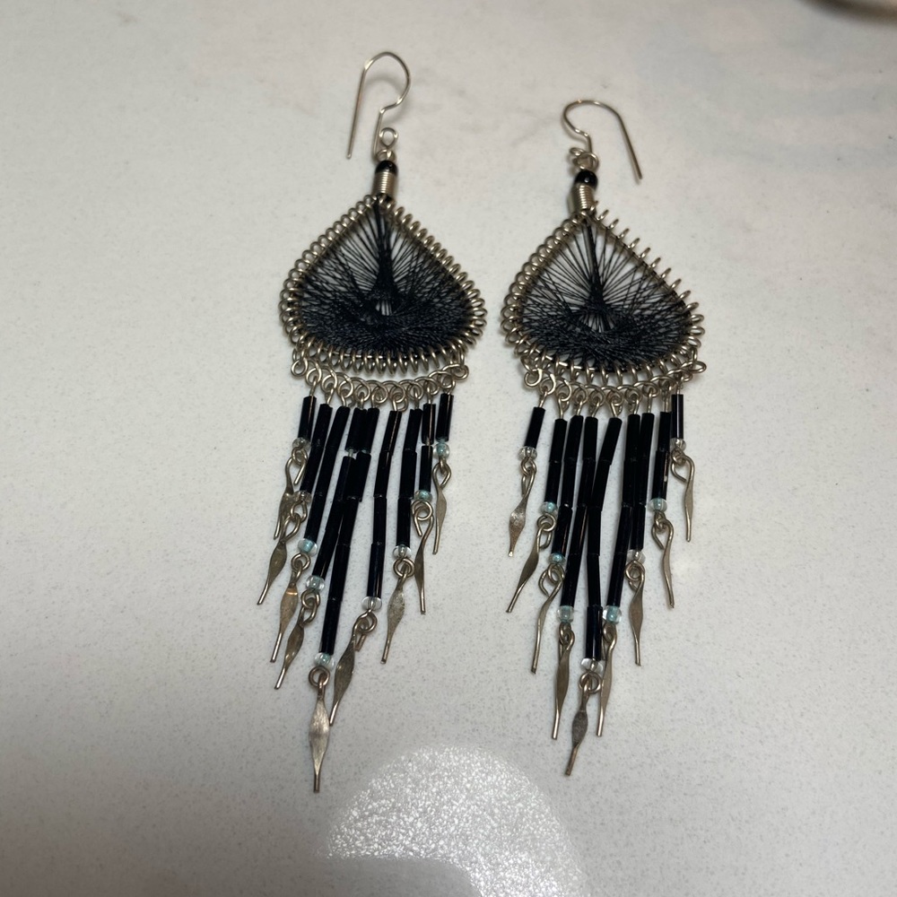 Earrings in intricate weave and beads